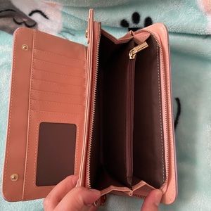 Cute long wallet with a lot of slots to put ur cash and recipts in..